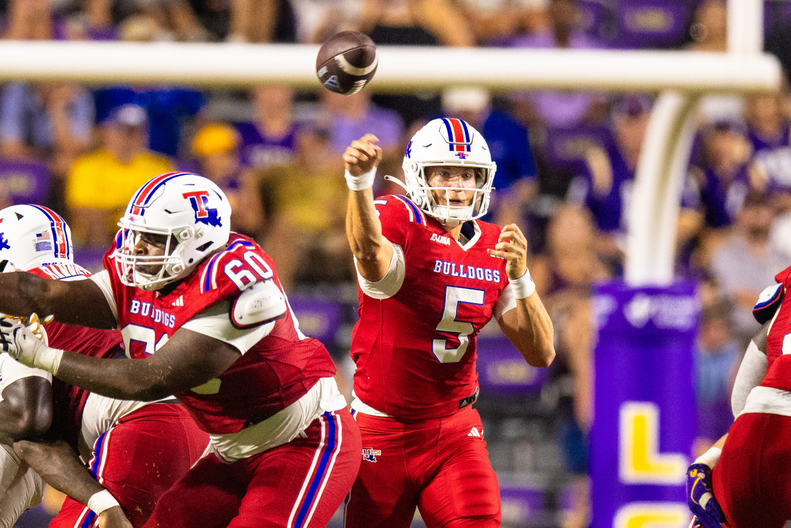 Sep 6, 2025; Baton Rouge, Louisiana, USA; Louisiana Tech Bulldogs quarterback Blake Baker (5) passes against LSU Tigers during the second half at Tiger Stadium. Mandatory Credit: Stephen Lew-Imagn Images