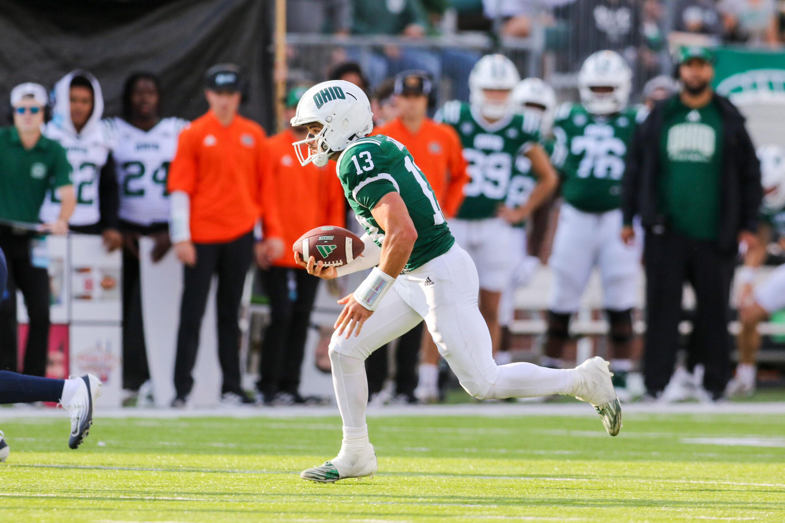 Sep 6, 2025; Athens, Ohio, USA; Ohio Bobcats quarterback Parker Navarro (13) runs the ball during the third quarter against the West Virginia Mountaineers at Peden Stadium. Mandatory Credit: Ben Queen-Imagn Images