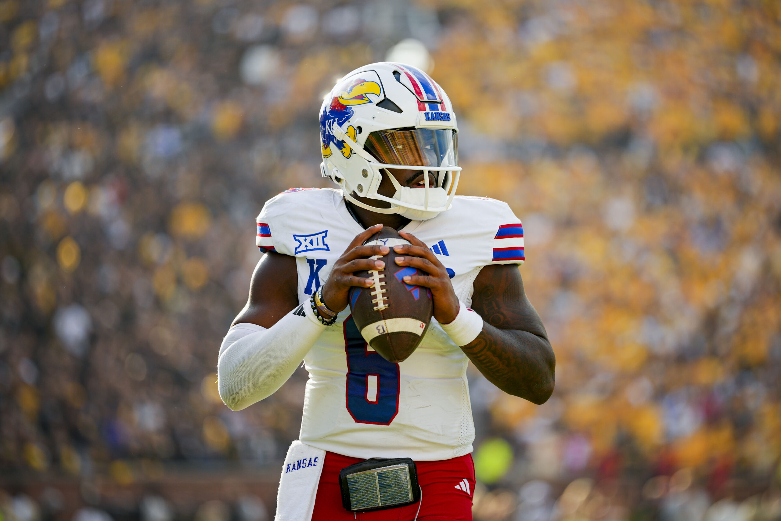 Sep 6, 2025; Columbia, Missouri, USA; Kansas Jayhawks quarterback Jalon Daniels (6) warms up during the second half against the Missouri Tigers at Faurot Field at Memorial Stadium. Mandatory Credit: Jay Biggerstaff-Imagn Images