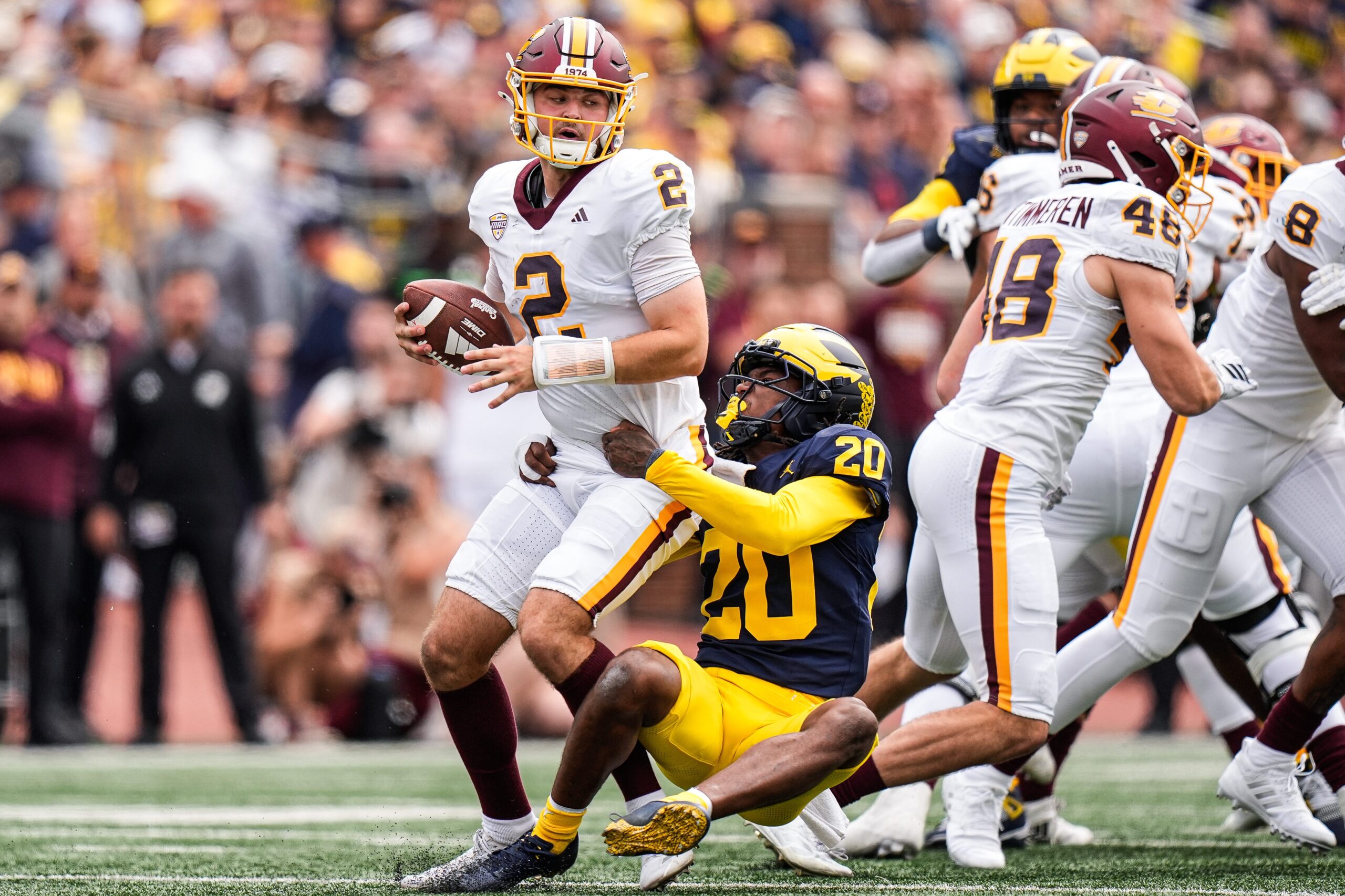 Michigan defensive back Jyaire Hill (20) sacks Central Michigan quarterback Joe Labas (2) during the first half at Michigan Stadium in Ann Arbor on Saturday, Sept. 13, 2025.