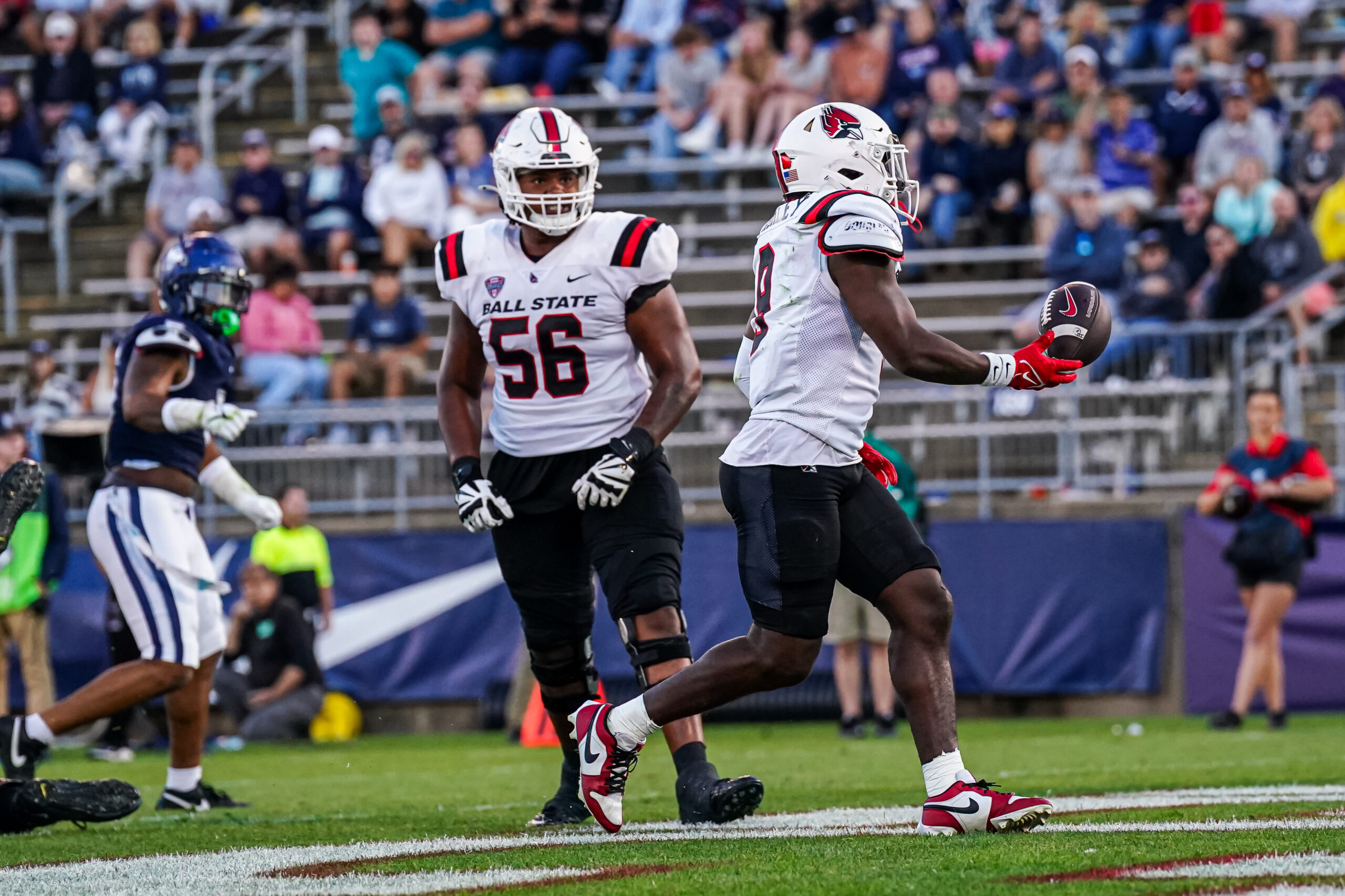 Sep 20, 2025; East Hartford, Connecticut, USA; Ball State Cardinals running back Qua Ashley (9) runs the ball for a touchdown against the Connecticut Huskies in the second half at Pratt & Whitney Stadium at Rentschler Field. Mandatory Credit: David Butler II-Imagn Images