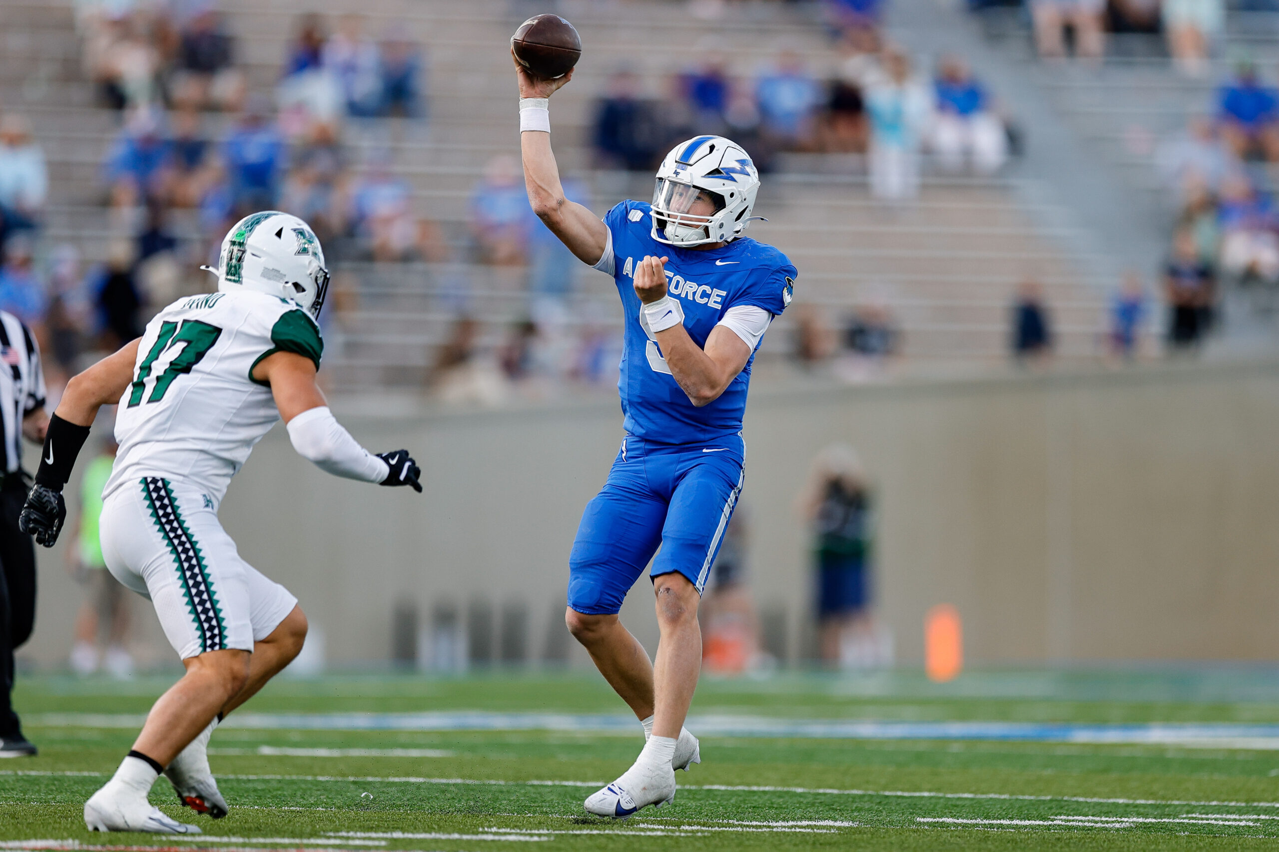 Sep 27, 2025; Colorado Springs, Colorado, USA; Air Force Falcons quarterback Liam Szarka (9) attempts a pass under pressure from Hawaii Rainbow Warriors linebacker Giovanni Iovino (17) in the fourth quarter at Falcon Stadium. Mandatory Credit: Isaiah J. Downing-Imagn Images