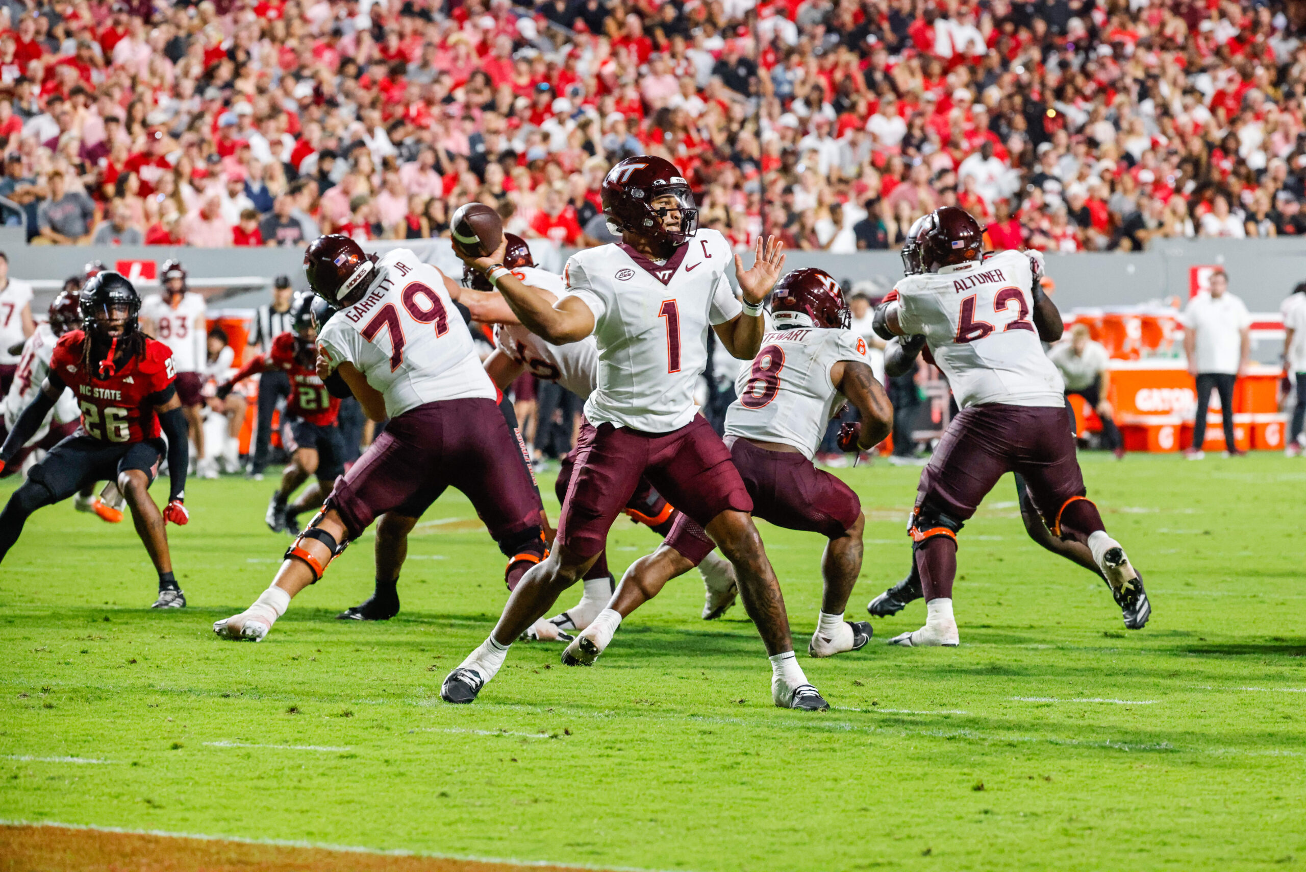 Sep 27, 2025; Raleigh, North Carolina, USA; Virginia Tech Hokies quarterback Kyron Drones (1) attempts to throw the ball during the first half of the game against North Carolina State Wolfpack at Carter-Finley Stadium. Mandatory Credit: Jaylynn Nash-Imagn Images