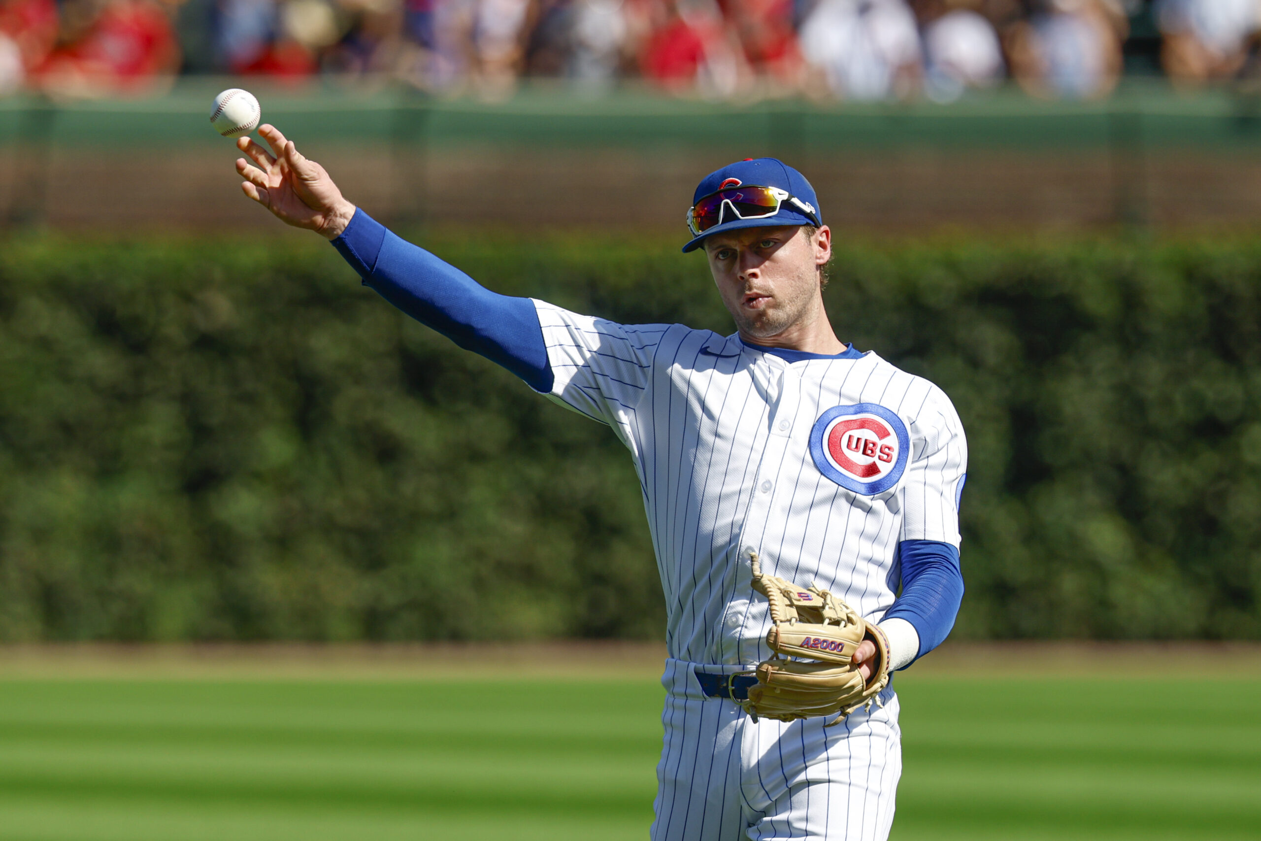 Sep 27, 2025; Chicago, Illinois, USA; Chicago Cubs second baseman Nico Hoerner (2) warms up before a baseball game against the St. Louis Cardinals at Wrigley Field. Mandatory Credit: Kamil Krzaczynski-Imagn Images