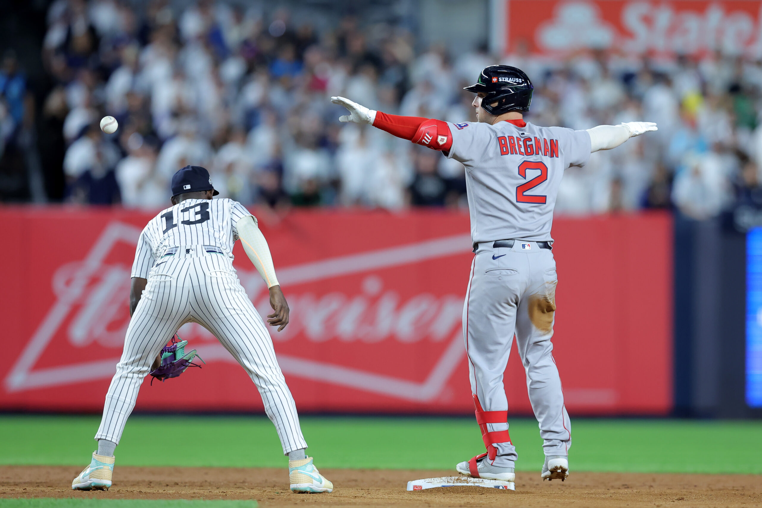 Sep 30, 2025; Bronx, New York, USA; Boston Red Sox third baseman Alex Bregman (2) celebrates his RBI double against the New York Yankees during the ninth inning of game one of the Wildcard round of the 2025 MLB playoffs at Yankee Stadium. Mandatory Credit: Brad Penner-Imagn Images
