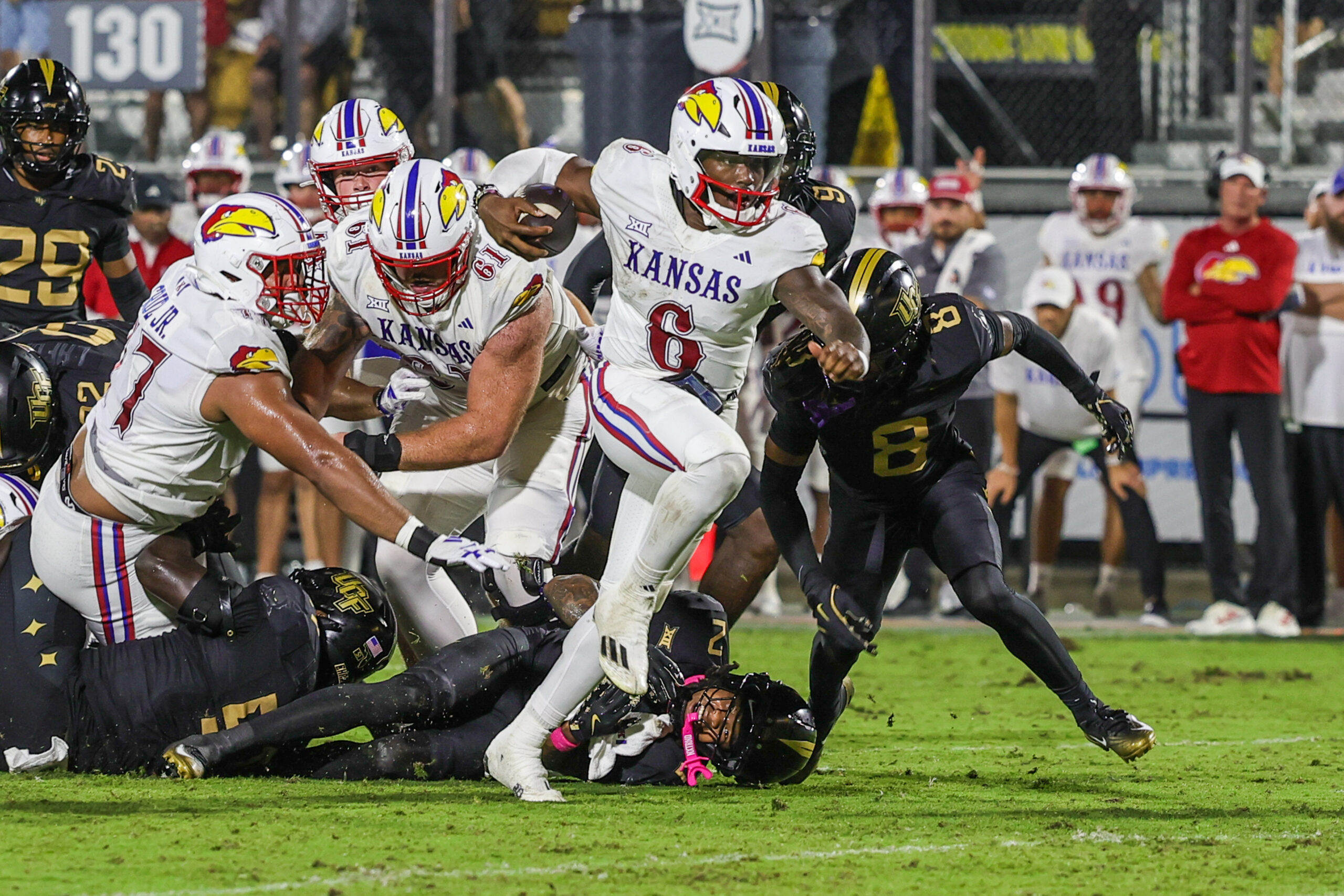 Oct 4, 2025; Orlando, Florida, USA; Kansas Jayhawks quarterback Jalon Daniels (6) carries the ball during the second quarter against the UCF Knights at FBC Mortgage Stadium. Mandatory Credit: Mike Watters-Imagn Images