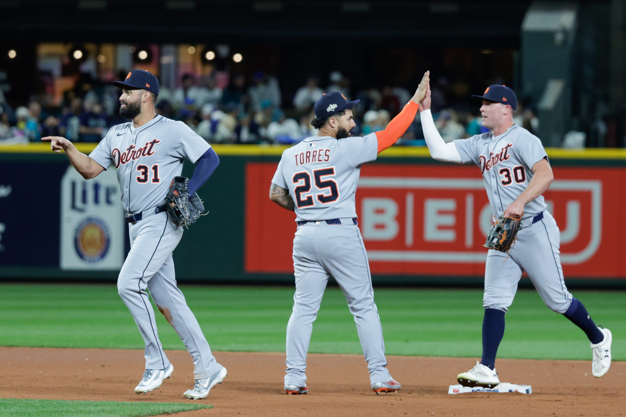 Oct 4, 2025; Seattle, Washington, USA; Detroit Tigers second baseman Gleyber Torres (25) celebrates with outfielder Kerry Carpenter (30) after defeating the Seattle Mariners during game one of the ALDS round for the 2025 MLB playoffs at T-Mobile Park. Mandatory Credit: Joe Nicholson-Imagn Images