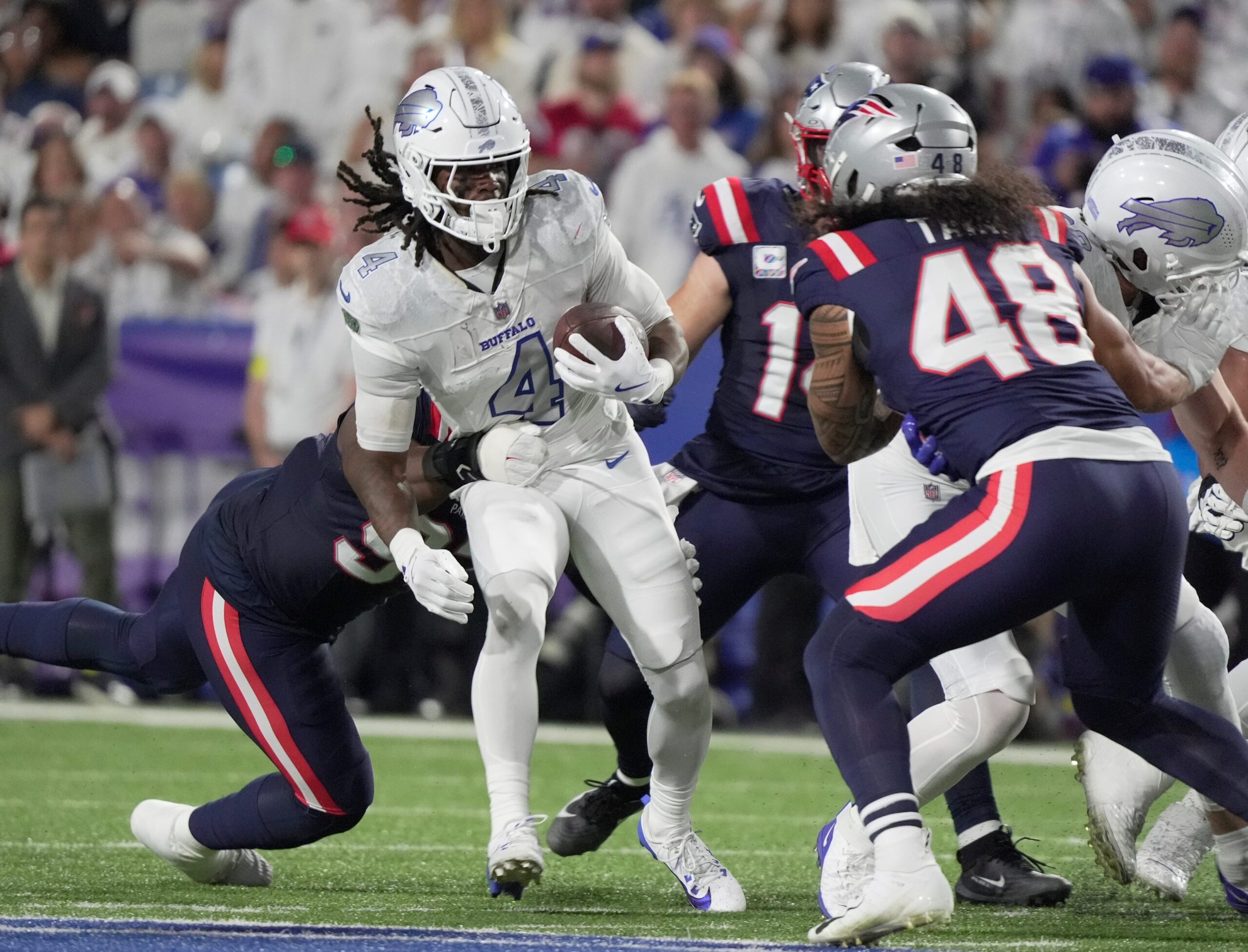 Buffalo Bills running back James Cook carries the ball during firsts half action at Highmark Stadium in Orchard Park on Oct. 5, 2025.