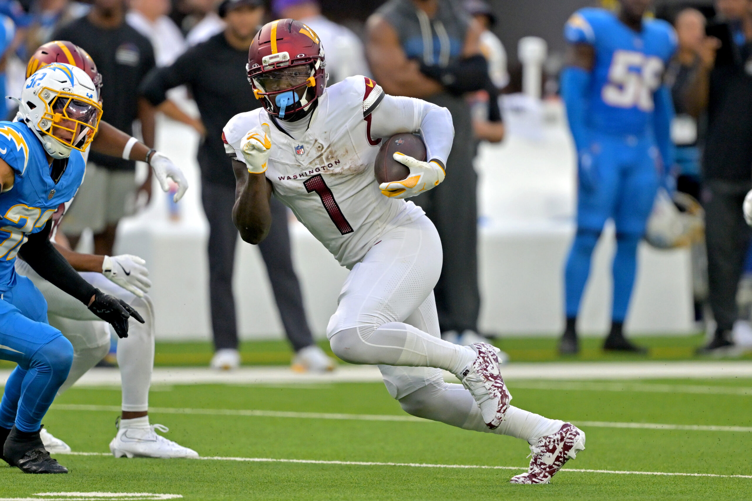 Oct 5, 2025; Inglewood, California, USA; Washington Commanders wide receiver Deebo Samuel Sr. (1) runs against the Los Angeles Chargers at SoFi Stadium. Mandatory Credit: Jayne Kamin-Oncea-Imagn Images