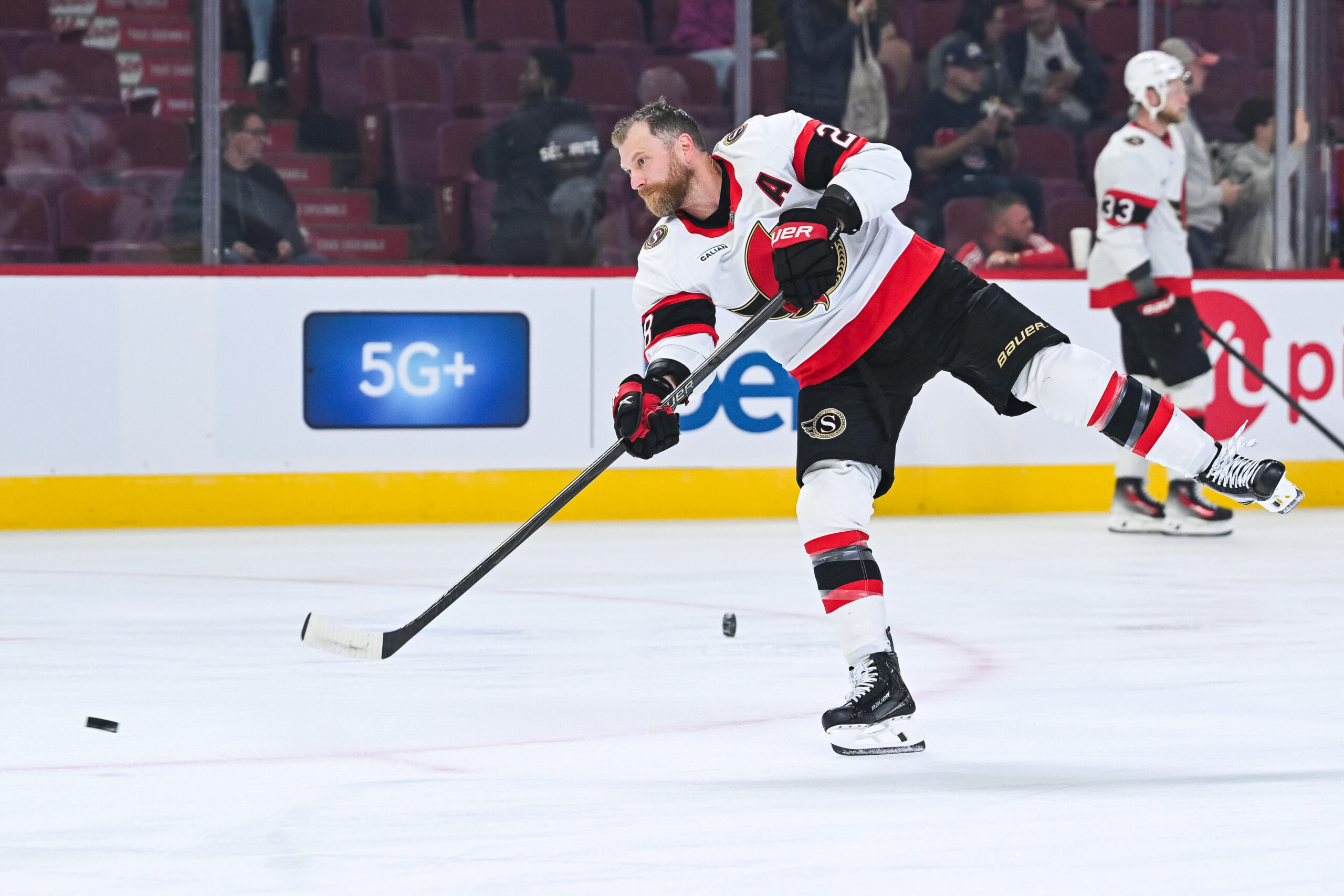 Oct 4, 2025; Montreal, Quebec, CAN; Ottawa Senators right wing Claude Giroux (28) shoots a puck during warm-up before the game against the Montreal Canadiens at Bell Centre. Mandatory Credit: David Kirouac-Imagn Images