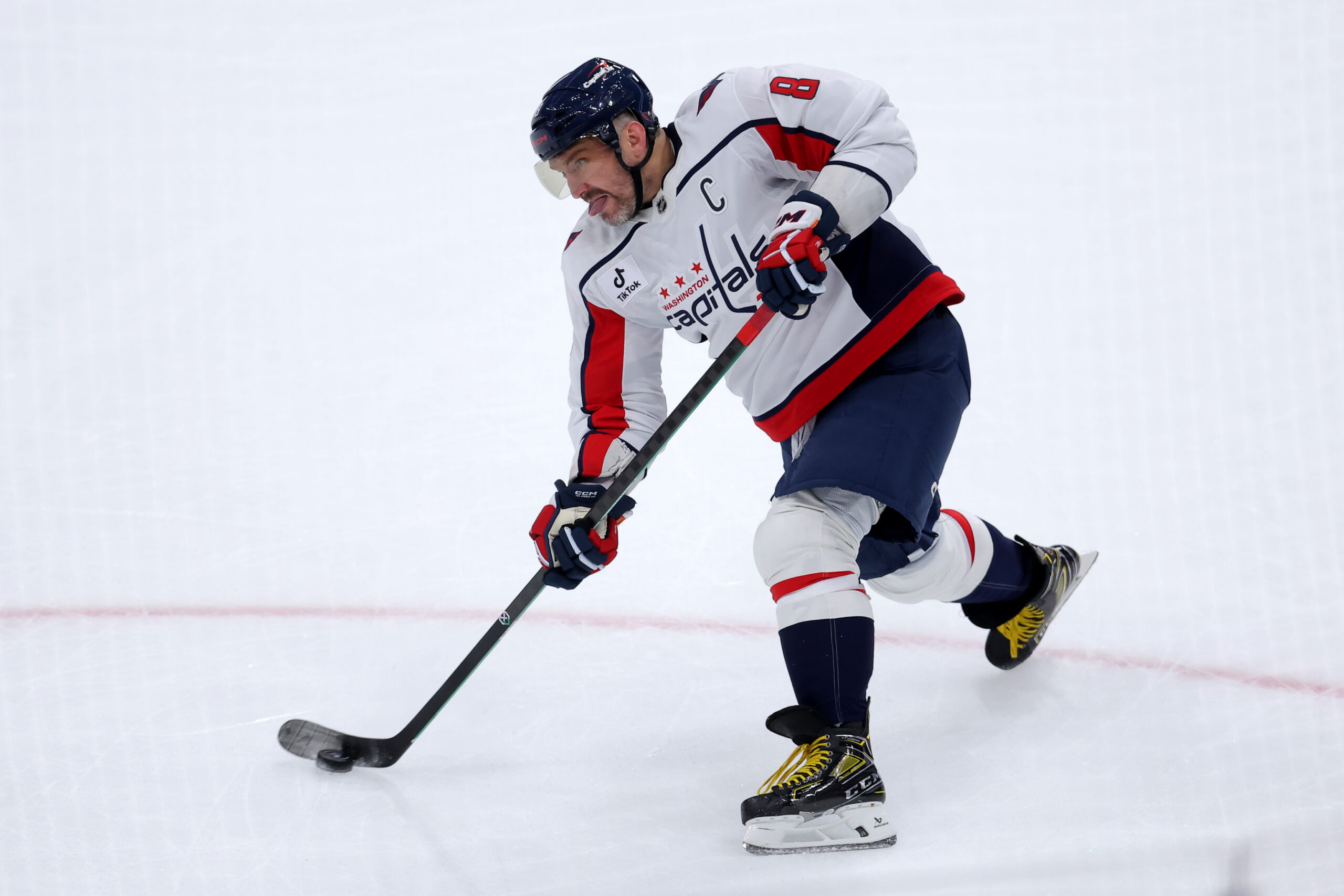 Oct 11, 2025; Elmont, New York, USA; Washington Capitals left wing Alex Ovechkin (8) takes a shot against the New York Islanders during the first period at UBS Arena. Mandatory Credit: Brad Penner-Imagn Images