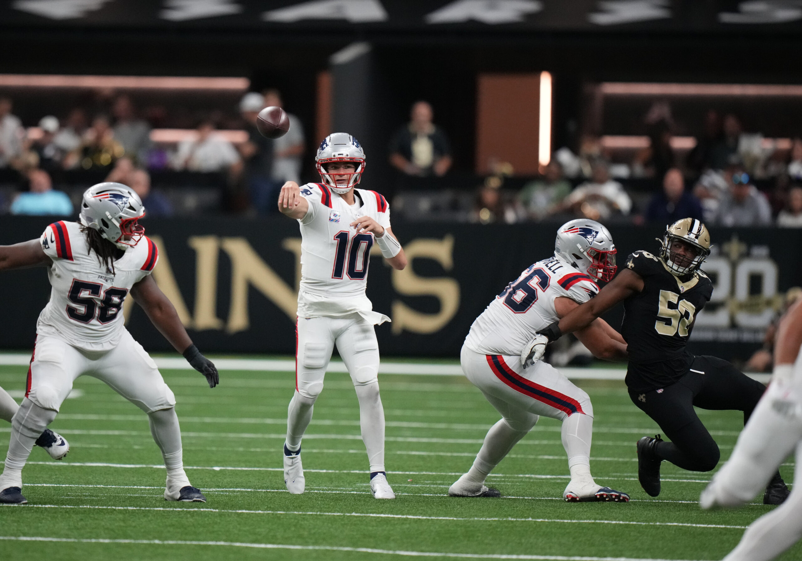 Oct 12, 2025; New Orleans, Louisiana, USA; New England Patriots quarterback Drake Maye (10) throws downfield during the second half against the New Orleans Saints at Caesars Superdome. Mandatory Credit: Matthew Hinton-Imagn Images