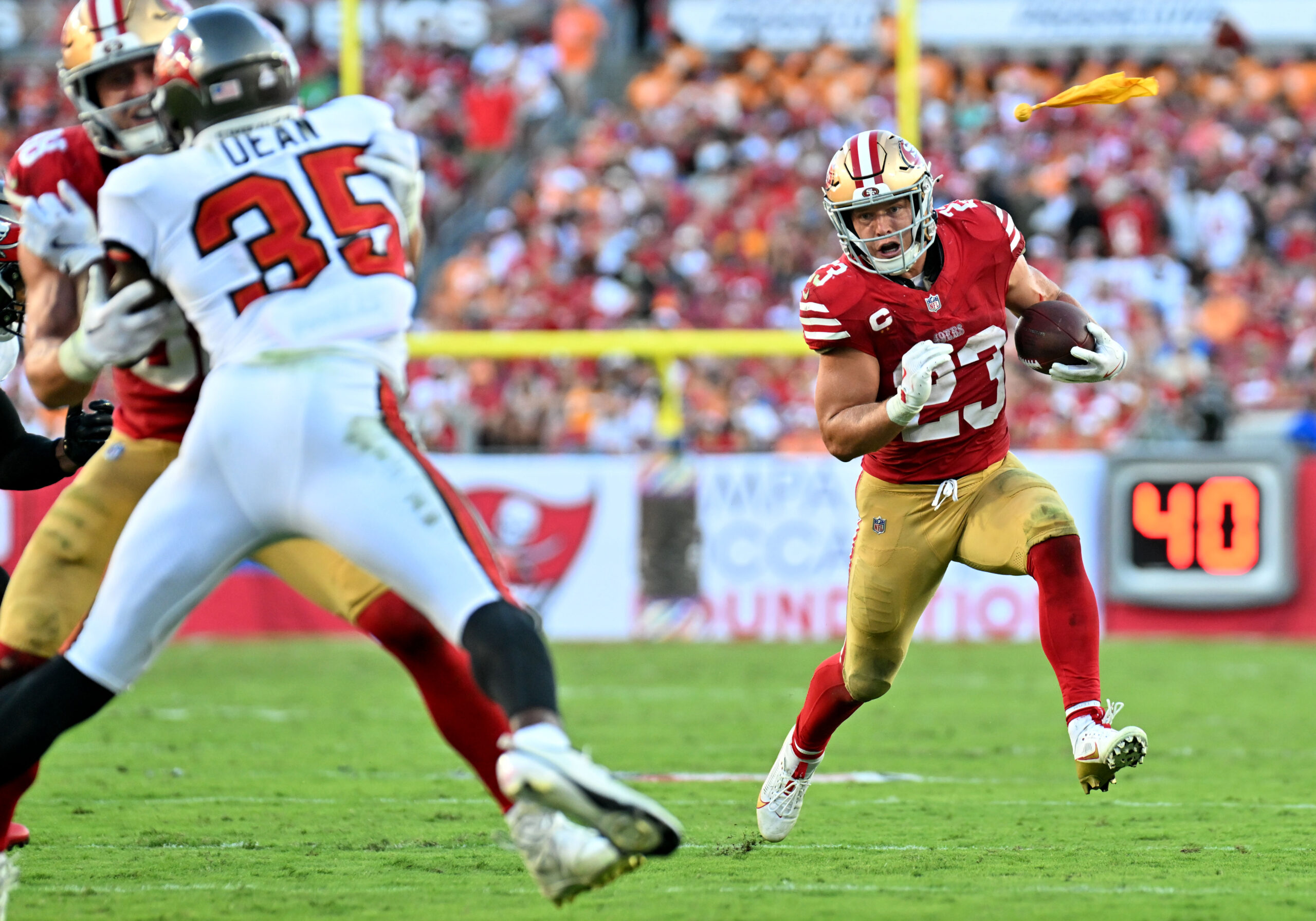 Oct 12, 2025; Tampa, Florida, USA; San Francisco 49ers running back Christian McCaffrey (23) runs for a gain during the third quarter against the Tampa Bay Buccaneers at Raymond James Stadium. Mandatory Credit: Jonathan Dyer-Imagn Images