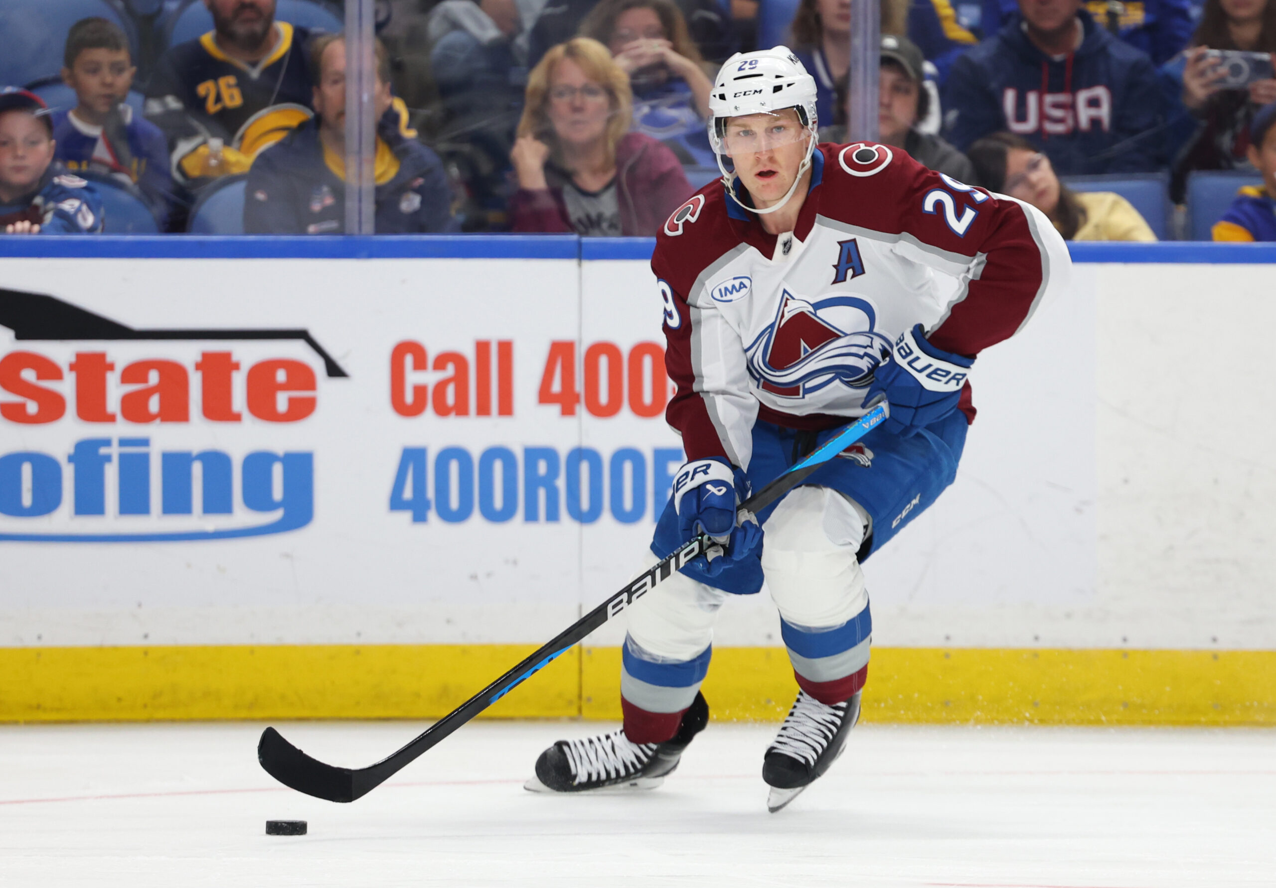 Oct 13, 2025; Buffalo, New York, USA;  Colorado Avalanche center Nathan MacKinnon (29) looks to make a pass during the third period against the Buffalo Sabres at KeyBank Center. Mandatory Credit: Timothy T. Ludwig-Imagn Images