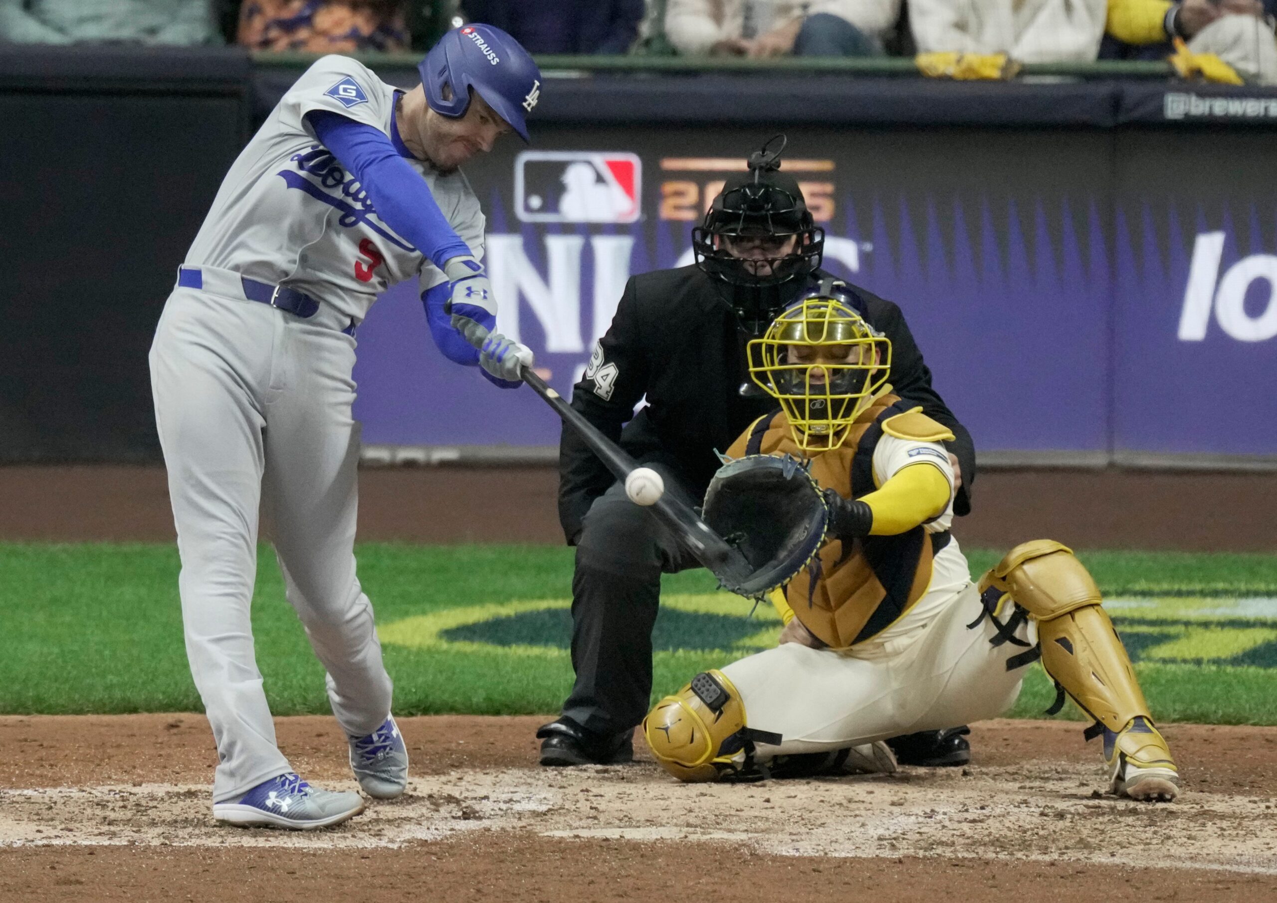 Los Angeles Dodgers first baseman Freddie Freeman (5) hits a solo home run during the sixth inning of their National League Championship Series game against the Milwaukee Brewers October 13, 2025 at American Family Field in Milwaukee, Wisconsin.