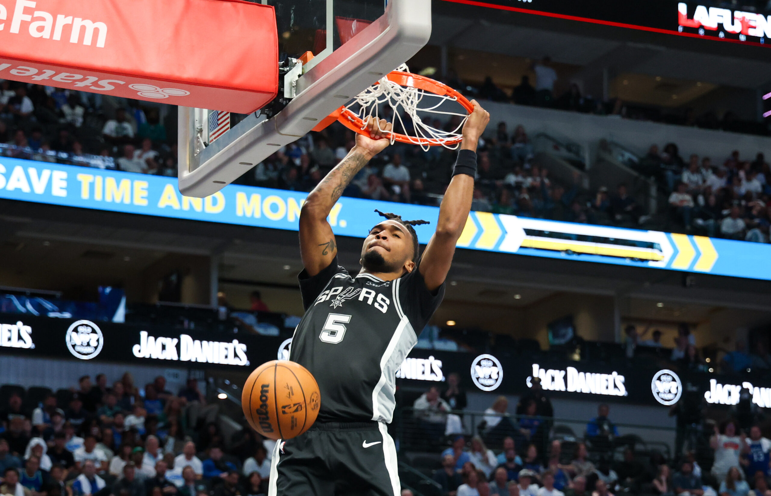 Oct 22, 2025; Dallas, Texas, USA;   San Antonio Spurs guard Stephon Castle (5) dunks against the Dallas Mavericks during the second half at American Airlines Center. Mandatory Credit: Kevin Jairaj-Imagn Images