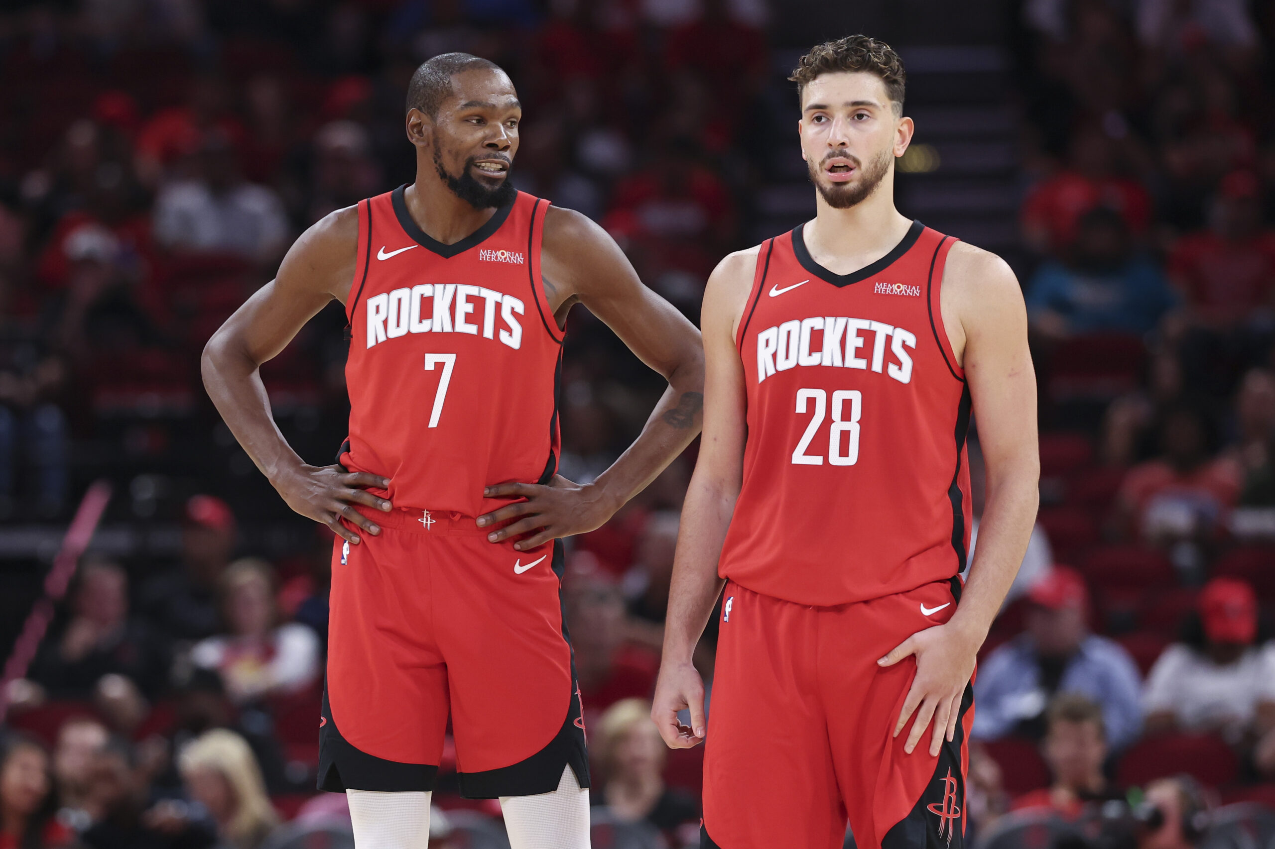 Oct 24, 2025; Houston, Texas, USA; Houston Rockets forward Kevin Durant (7) talks with center Alperen Sengun (28) during the first quarter against the Detroit Pistons at Toyota Center. Mandatory Credit: Troy Taormina-Imagn Images