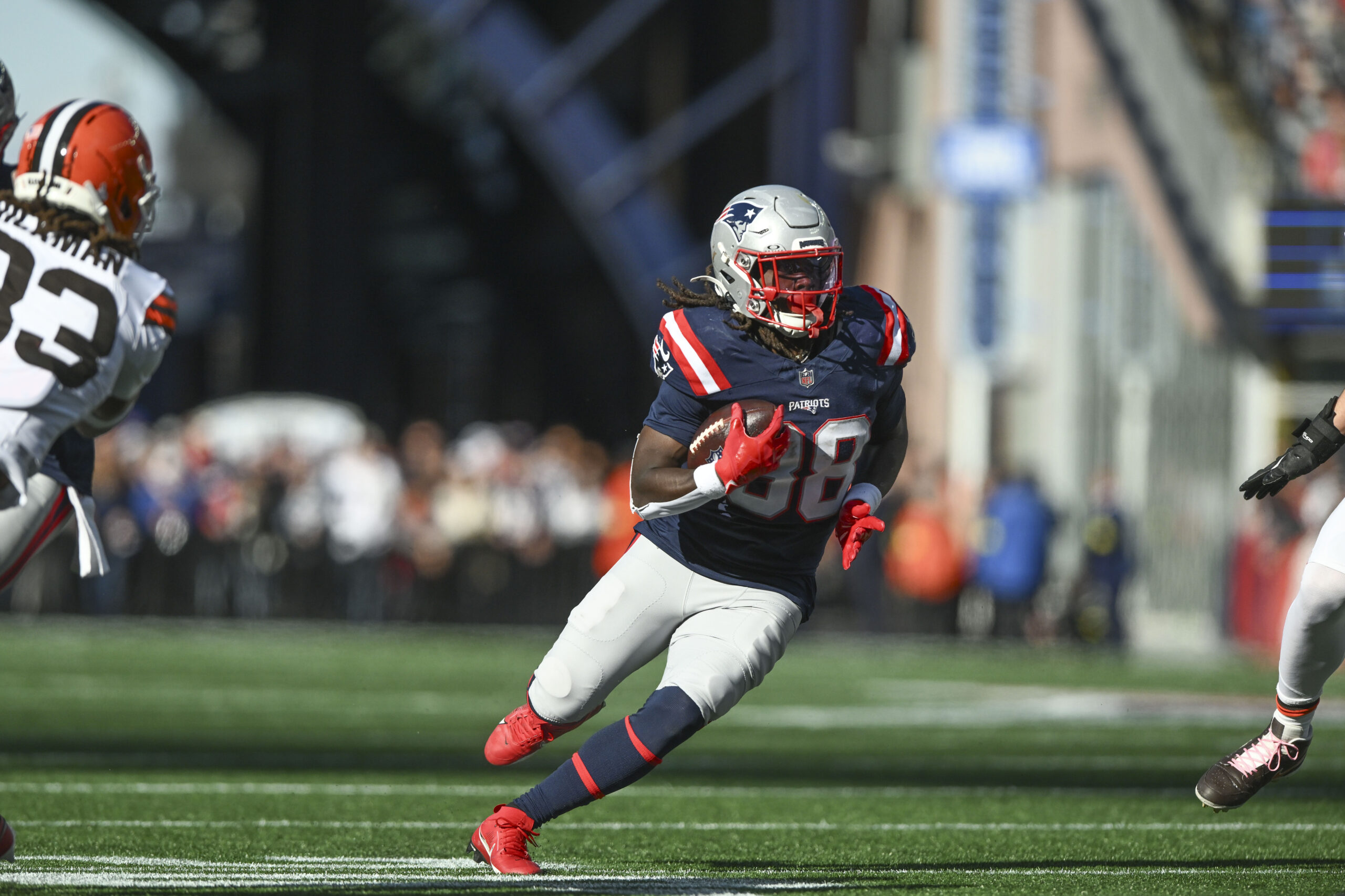 Oct 26, 2025; Foxborough, Massachusetts, USA;  New England Patriots running back Rhamondre Stevenson (38) runs with the ball during the third quarter against the Cleveland Browns at Gillette Stadium. Mandatory Credit: Brian Fluharty-Imagn Images