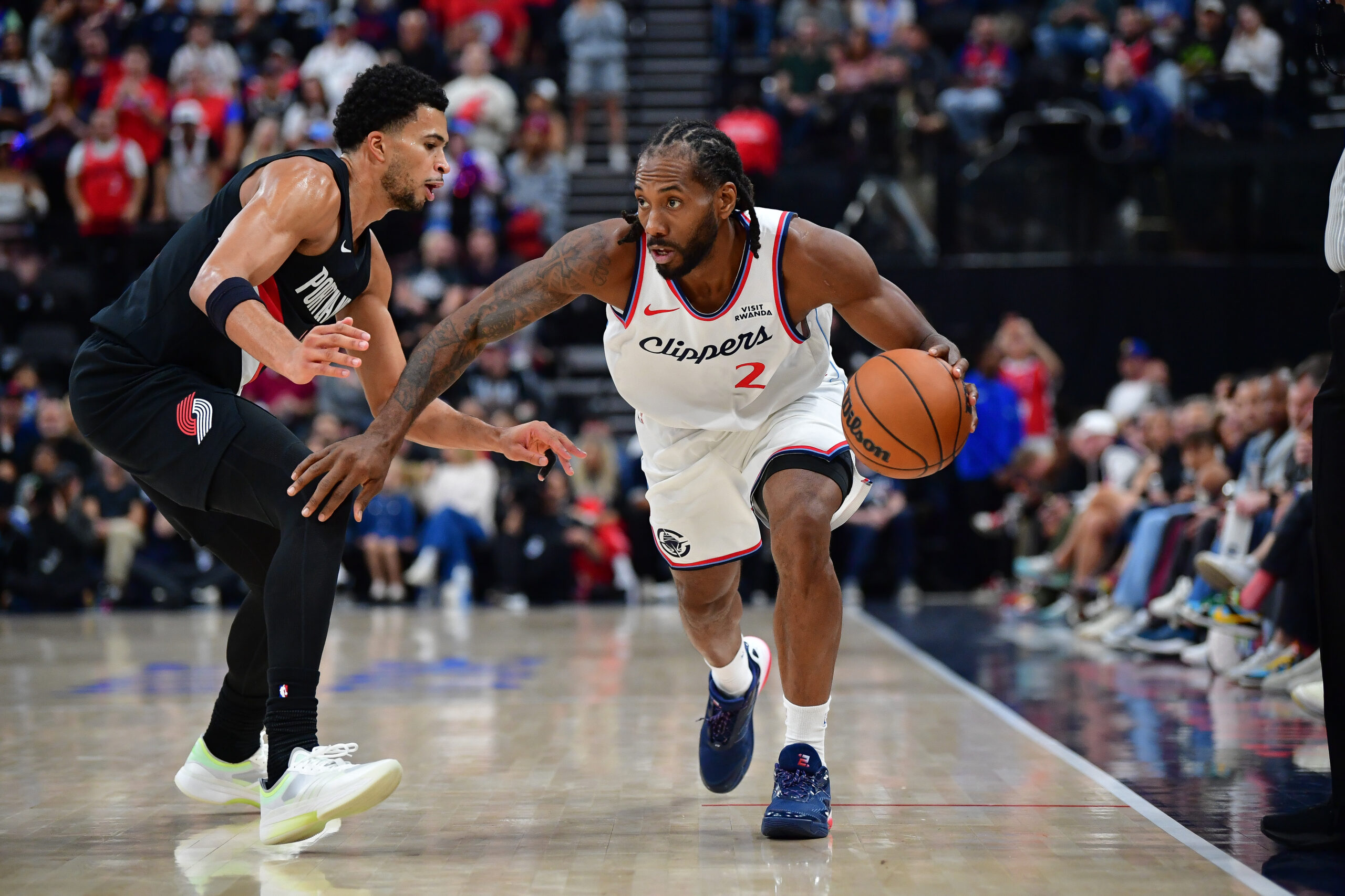 Oct 26, 2025; Inglewood, California, USA; Los Angeles Clippers forward Kawhi Leonard (2) moves the ball against Portland Trail Blazers forward Toumani Camara (33) during the first half at Intuit Dome. Mandatory Credit: Gary A. Vasquez-Imagn Images