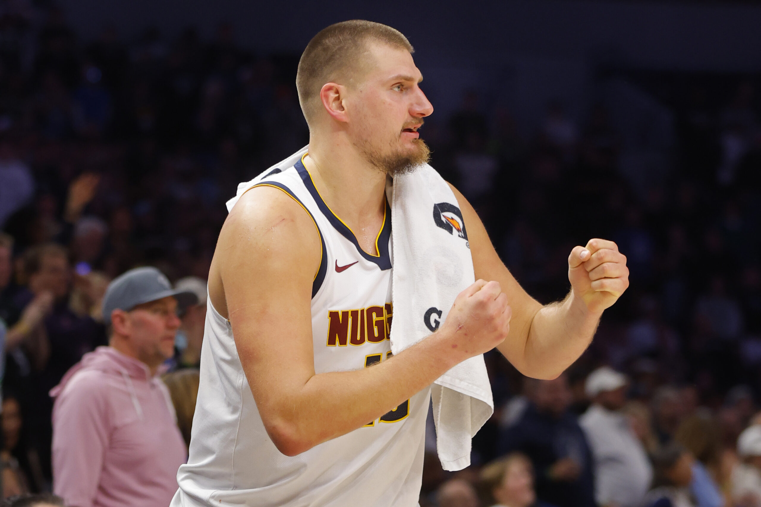 Oct 27, 2025; Minneapolis, Minnesota, USA; Denver Nuggets center Nikola Jokic (15) cheers on his team as he rests against the Minnesota Timberwolves in the fourth quarter at Target Center. Mandatory Credit: Bruce Kluckhohn-Imagn Images