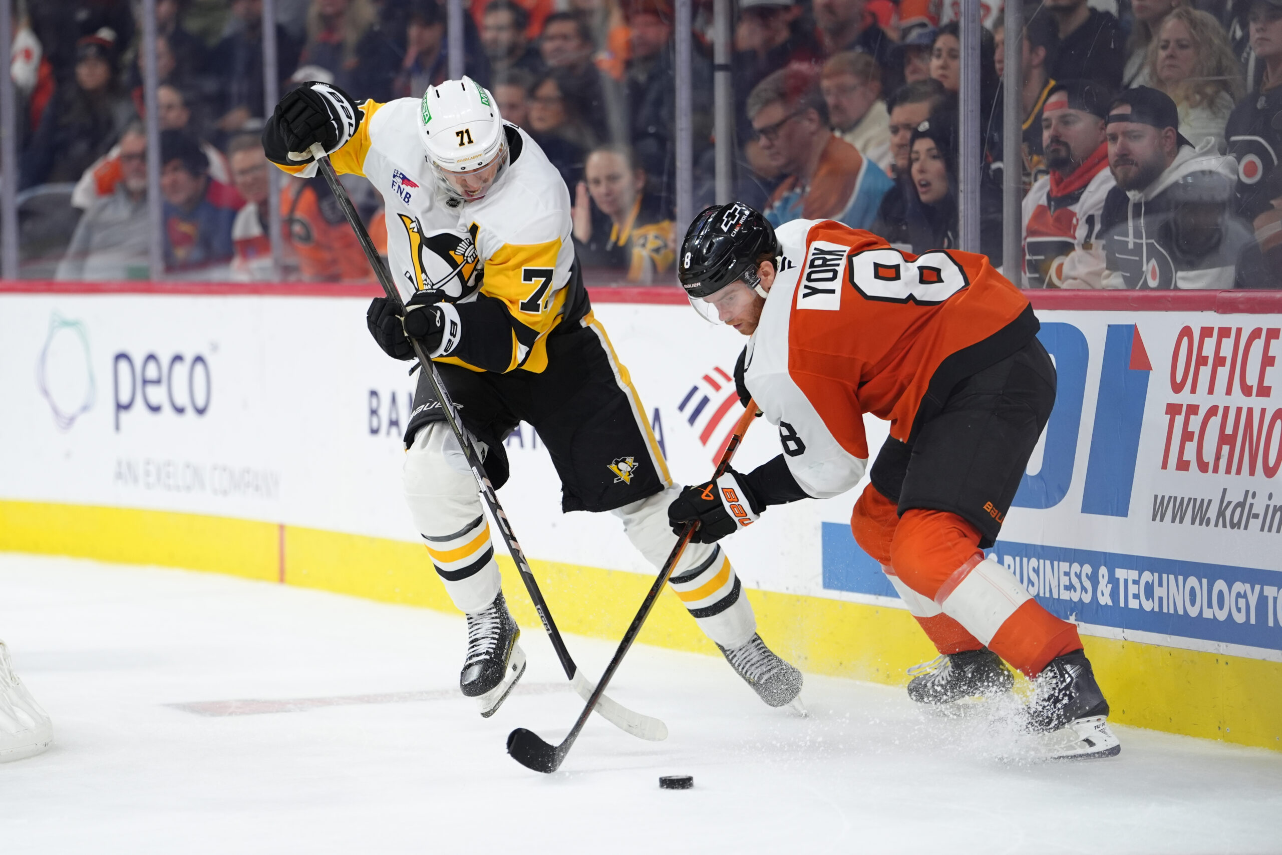 Oct 28, 2025; Philadelphia, Pennsylvania, USA; Pittsburgh Penguins center Evgeni Malkin (71) and Philadelphia Flyers defenseman Cam York (8) battle for the puck in overtime at Xfinity Mobile Arena. Mandatory Credit: Kyle Ross-Imagn Images