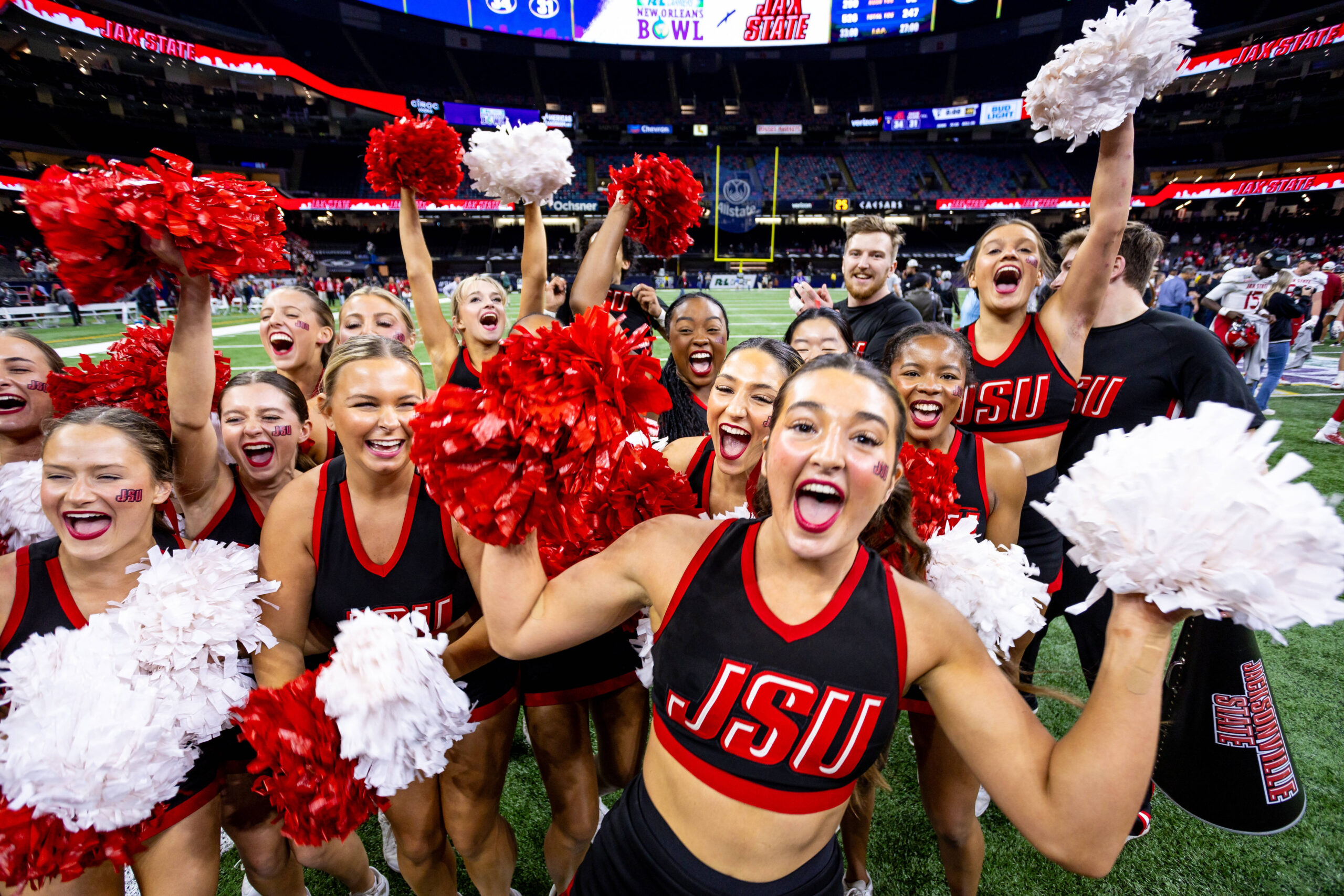 Dec 16, 2023; New Orleans, LA, USA;  Jacksonville State Gamecocks cheerleaders celebrate a field goal to defeat the Louisiana-Lafayette Ragin Cajuns in overtime at the Caesars Superdome. Mandatory Credit: Stephen Lew-Imagn Images