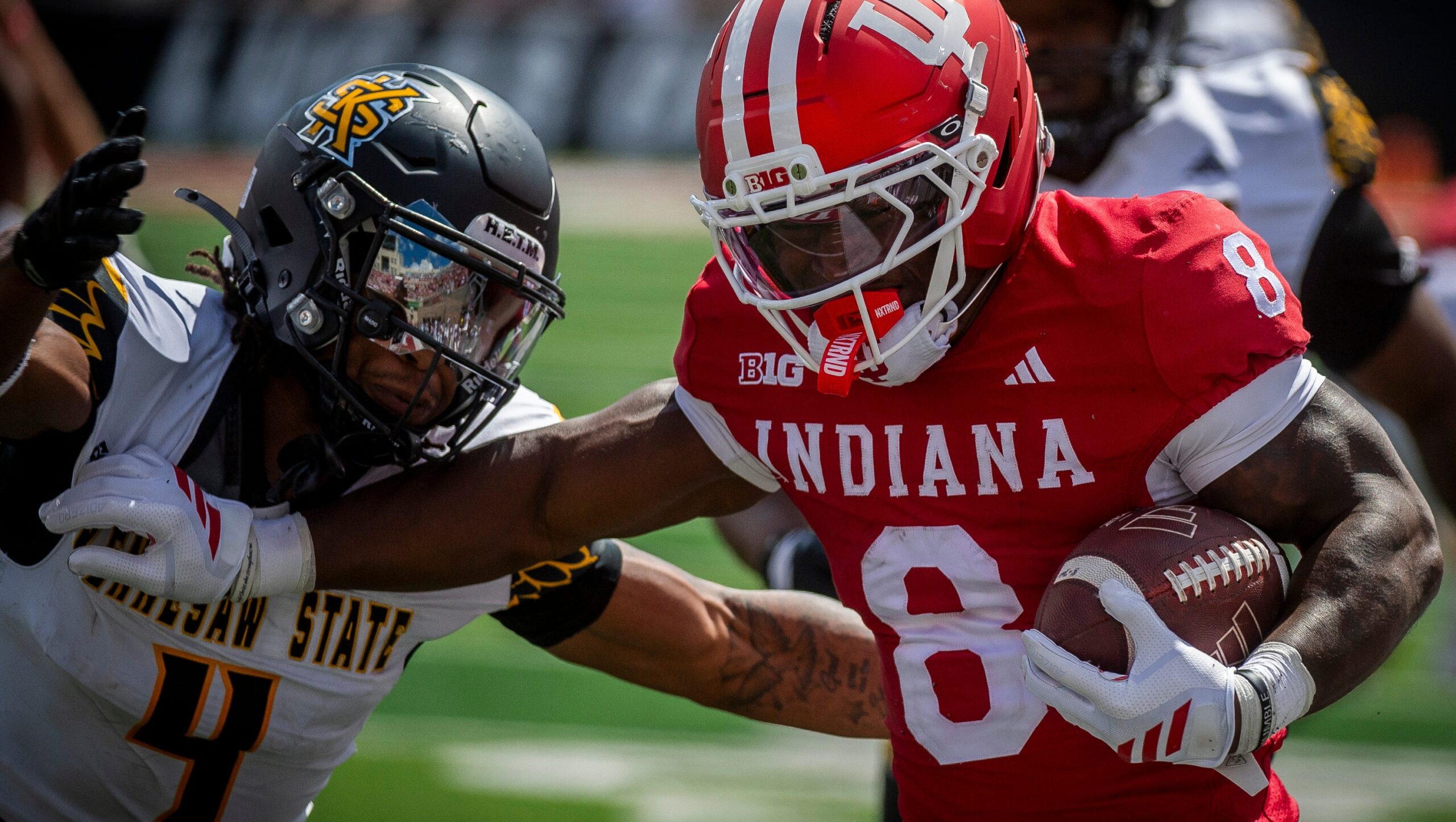 Indiana's Kaelon Black (8) avoids Kennesaw State's Alexander Ford (4) during the Indiana versus Kennesaw State Big Ten football game at Memorial Stadium on Saturday, Sept. 6, 2025.