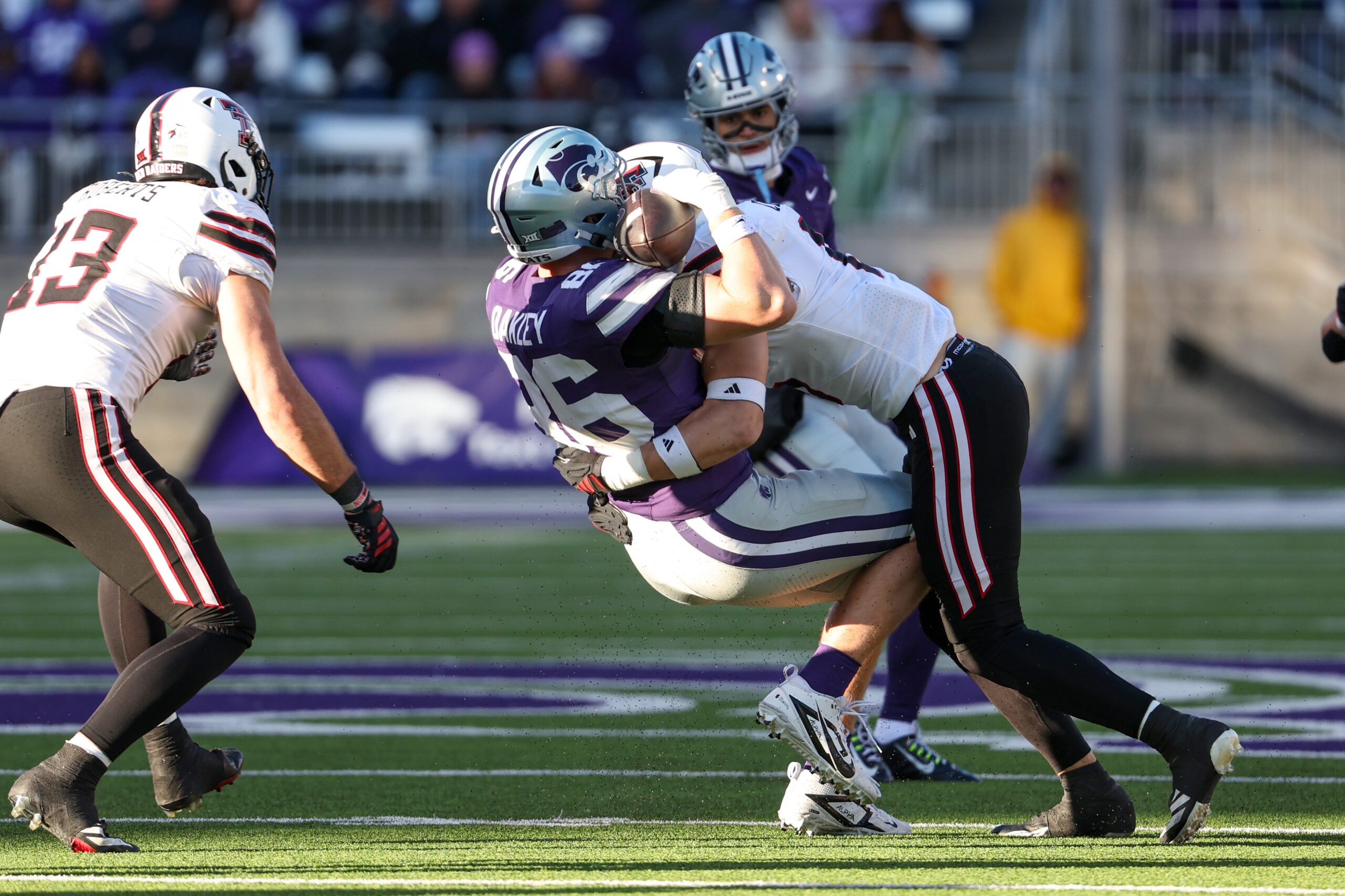 Nov 1, 2025; Manhattan, Kansas, USA;  Texas Tech Red Raiders linebacker John Curry (6) tackles Kansas State Wildcats tight end Garrett Oakley (86) during the fourth quarter at Bill Snyder Family Football Stadium. Mandatory Credit: Scott Sewell-Imagn Images