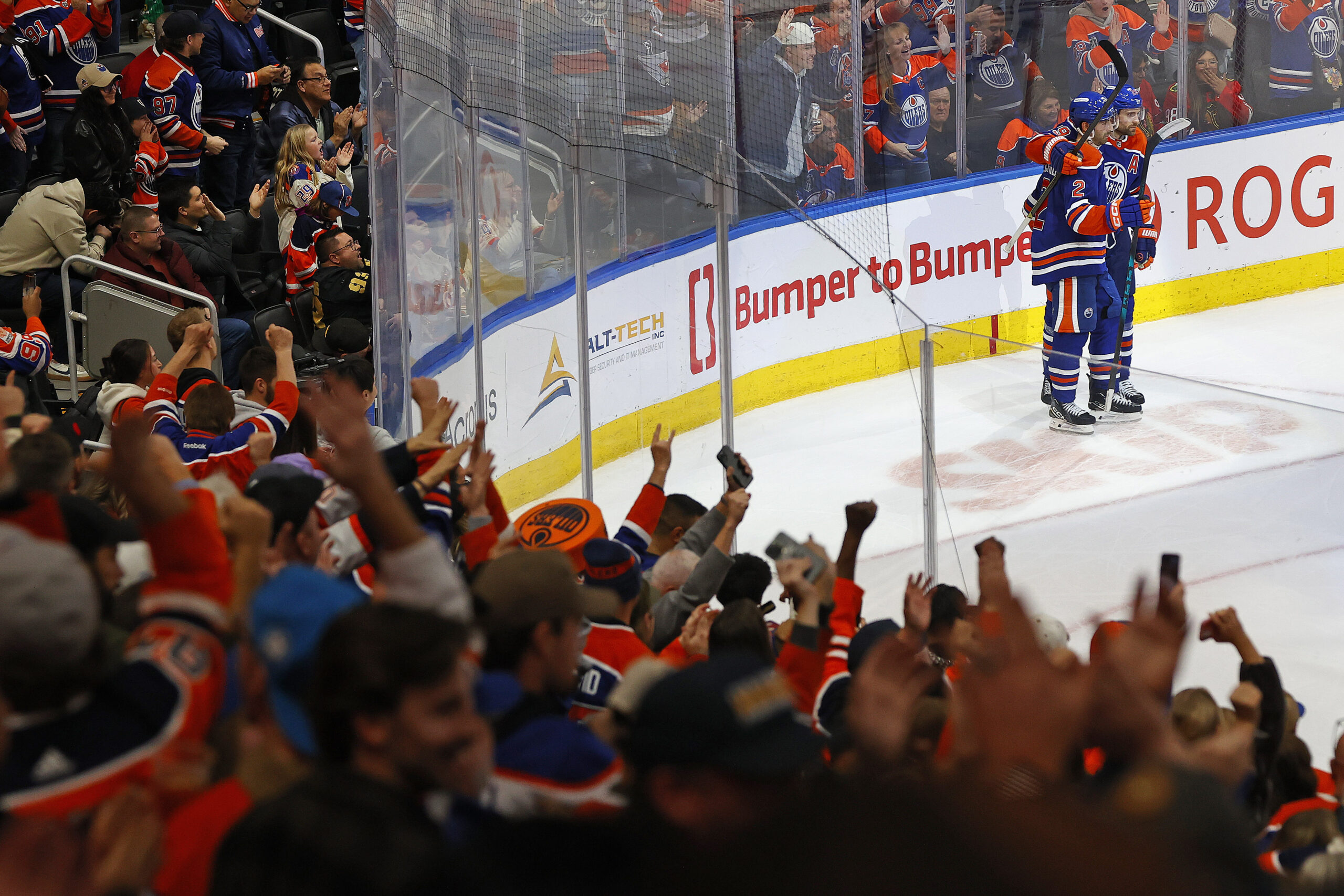 Nov 1, 2025; Edmonton, Alberta, CAN; The Edmonton Oilers celebrate a goal scored by defensemen Evan Bouchard (2) during overtime against the Chicago Blackhawks at Rogers Place. Mandatory Credit: Perry Nelson-Imagn Images