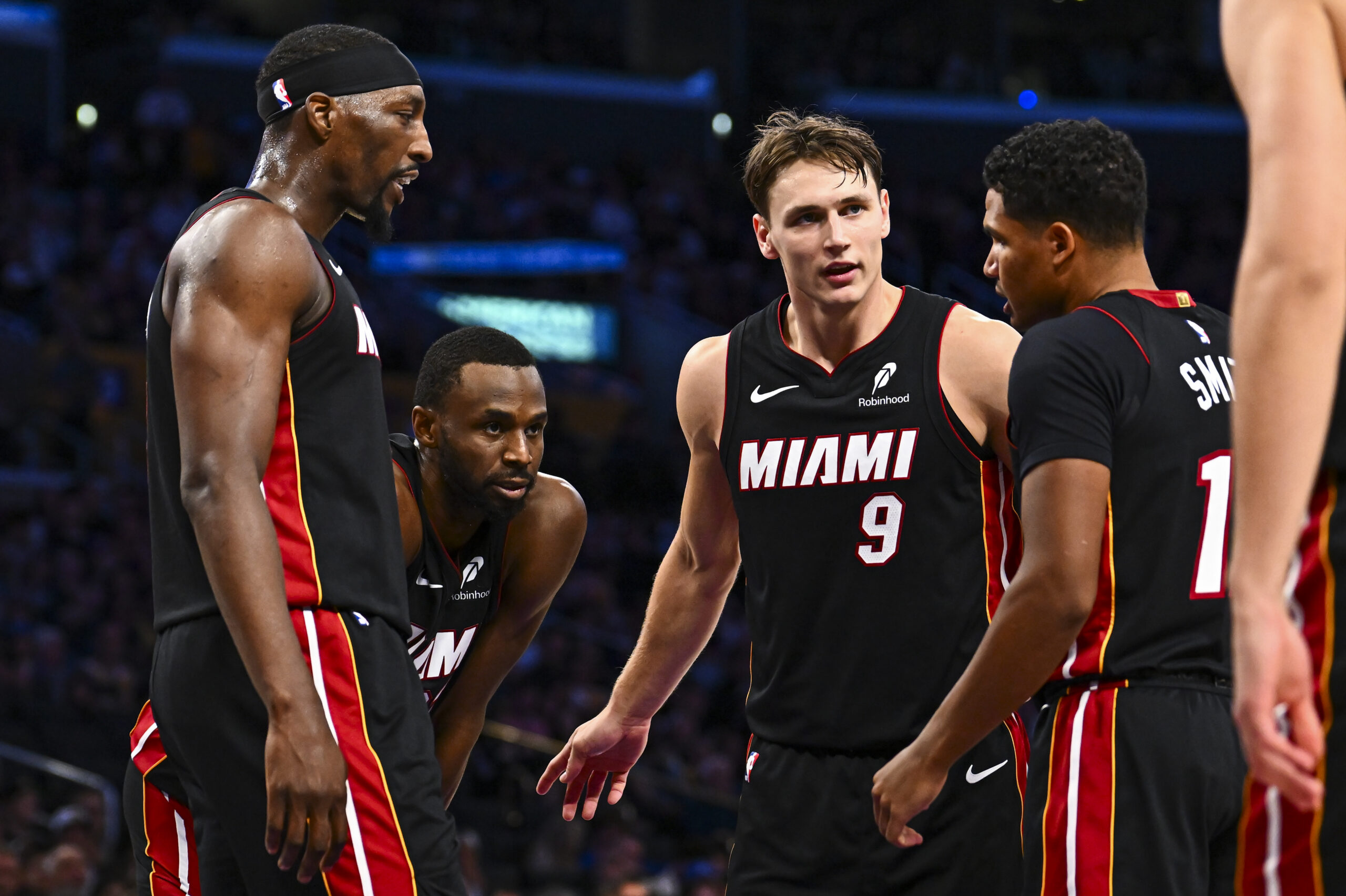 Nov 2, 2025; Los Angeles, California, USA; Miami Heat guard Pelle Larsson (9) meets with teammates during the game against the Los Angeles Lakers during the second half at Crypto.com Arena. Mandatory Credit: Jonathan Hui-Imagn Images