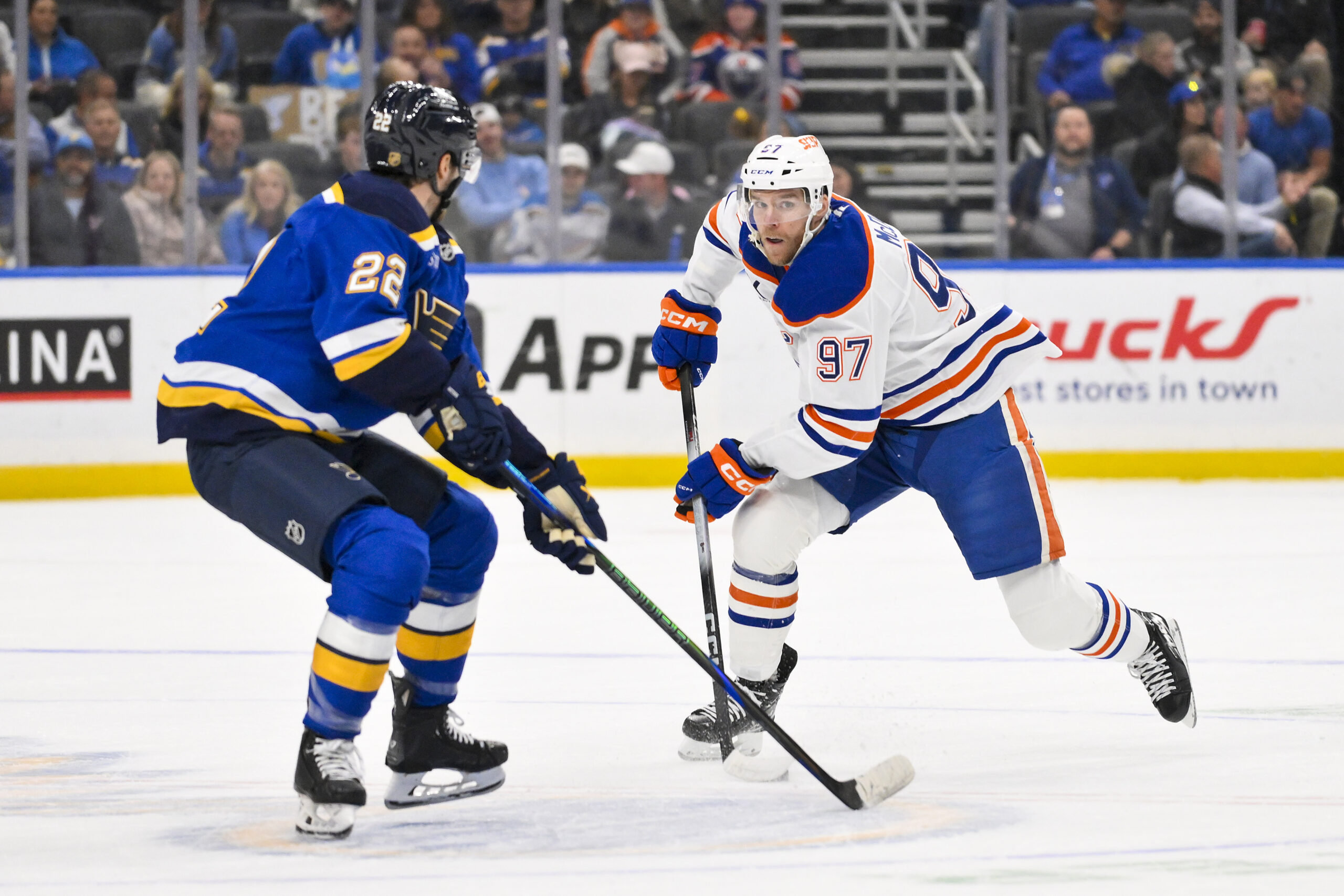 Nov 3, 2025; St. Louis, Missouri, USA; Edmonton Oilers center Connor McDavid (97) controls the puck as St. Louis Blues center Pius Suter (22) defends during the first period at Enterprise Center. Mandatory Credit: Jeff Curry-Imagn Images