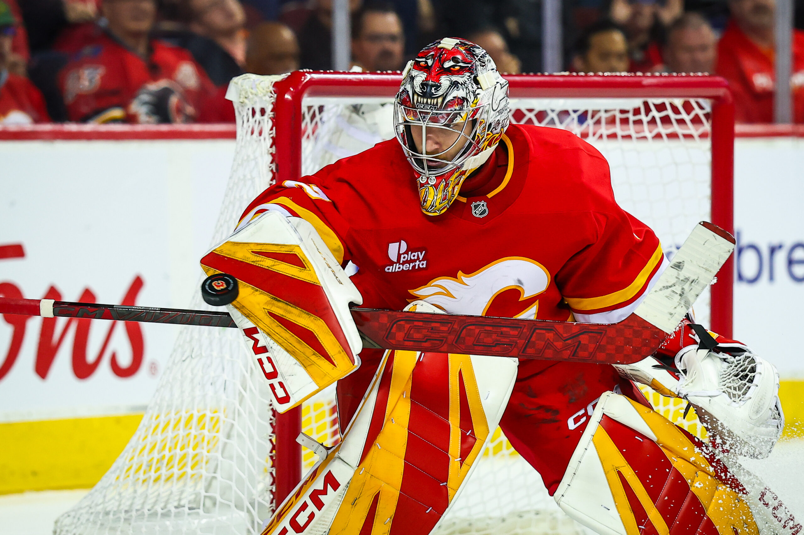 Nov 5, 2025; Calgary, Alberta, CAN; Calgary Flames goaltender Dustin Wolf (32) makes a save against the Columbus Blue Jackets during the third period at Scotiabank Saddledome. Mandatory Credit: Sergei Belski-Imagn Images
