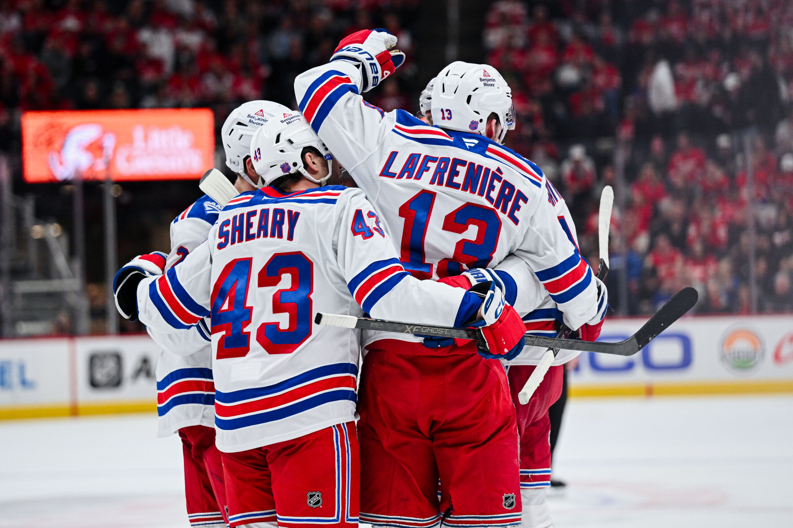 Nov 7, 2025; Detroit, Michigan, USA; New York Rangers left wing Alexis Lafrenière (13) celebrates his goal with teammates during the third period against the Detroit Red Wings at Little Caesars Arena. Mandatory Credit: Tim Fuller-Imagn Images