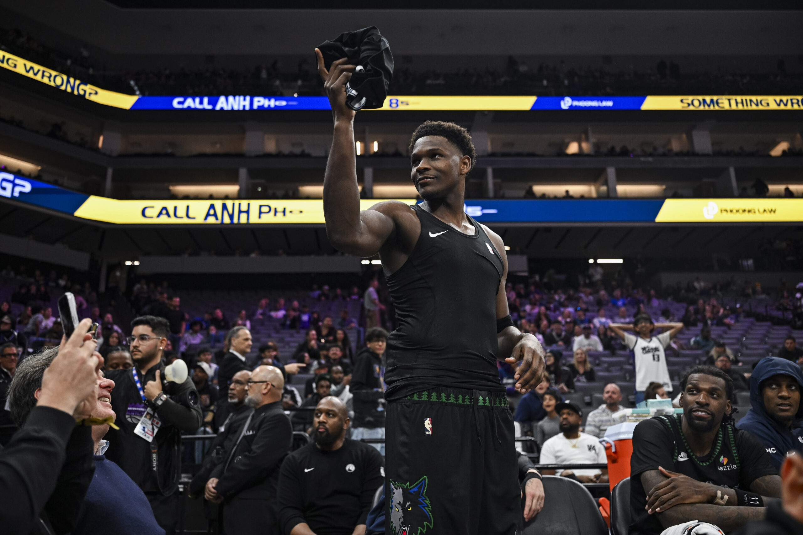 Nov 9, 2025; Sacramento, California, USA; Minnesota Timberwolves guard Anthony Edwards (5) gives his jersey to a young fan during the fourth quarter against the Sacramento Kings at Golden 1 Center. Mandatory Credit: Justine Willard-Imagn Images